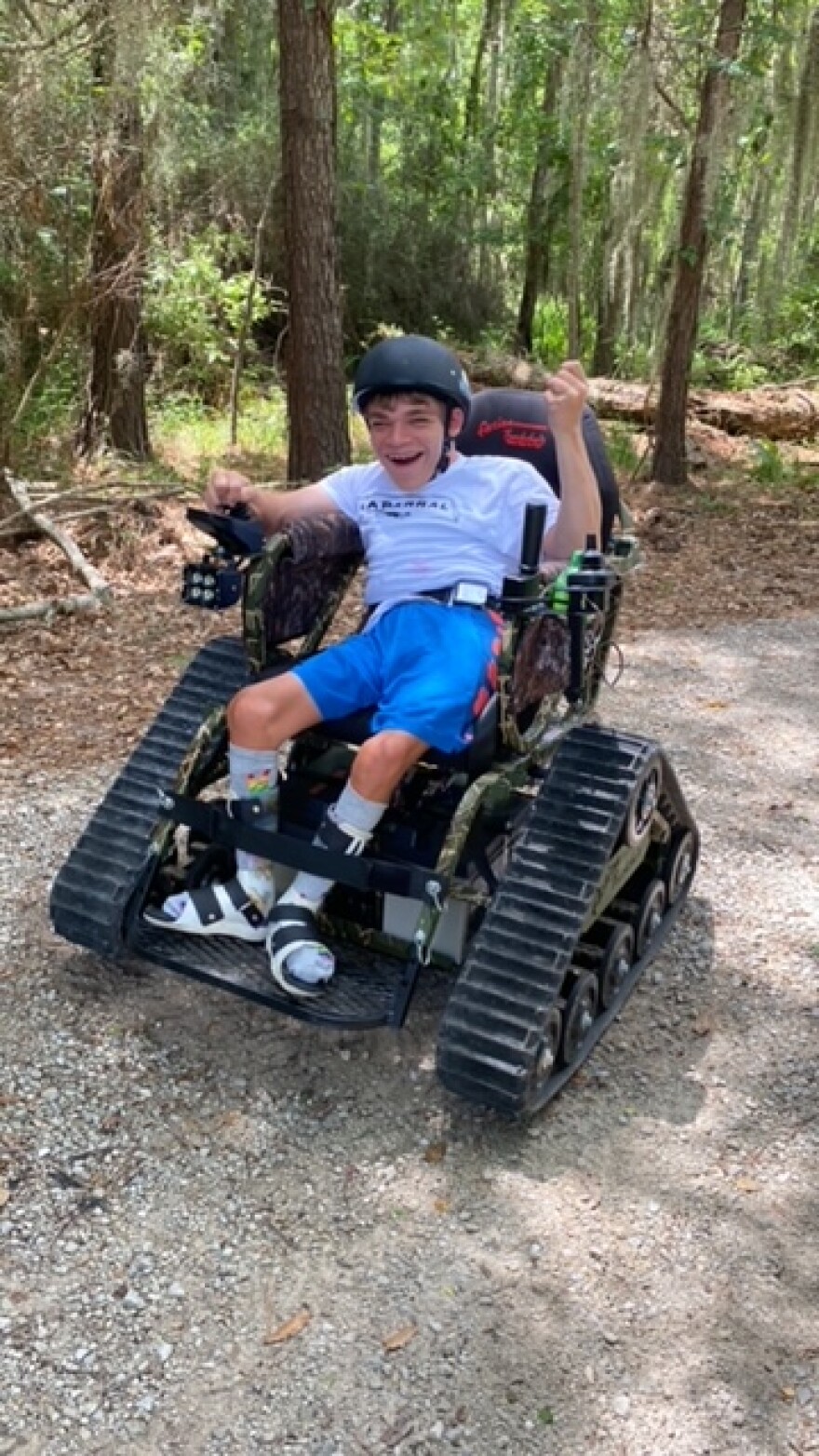 Elijah Clement enjoying the all-terrain wheelchair at Fontainebleau State Park