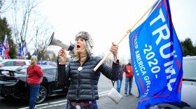 A woman shouts slogans as Trump Supporters gather during a car rally named as Stop the Steal on November 22, 2020 in Long Valley, New Jersey. (KENA BETANCUR/AFP via Getty Images)