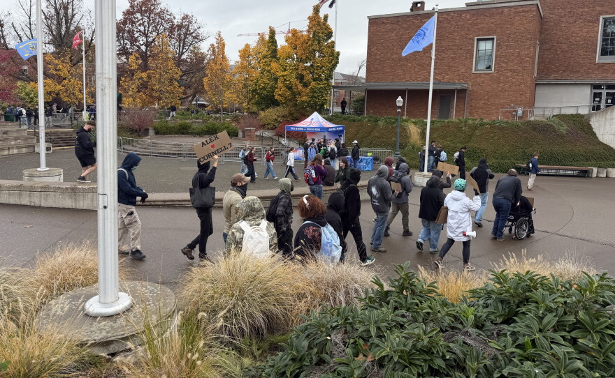 A group of protesters march into the EMU Amphitheater at the University of Oregon to protest the Turning Point USA debate event with Alex Stein, Oct. 28, 2026.