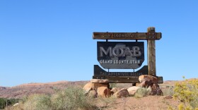 Photo of a road sign that welcomes visitors to moab