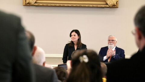 Governor Kelly Ayotte stands in Representatives Hall in the State House during her budget address.