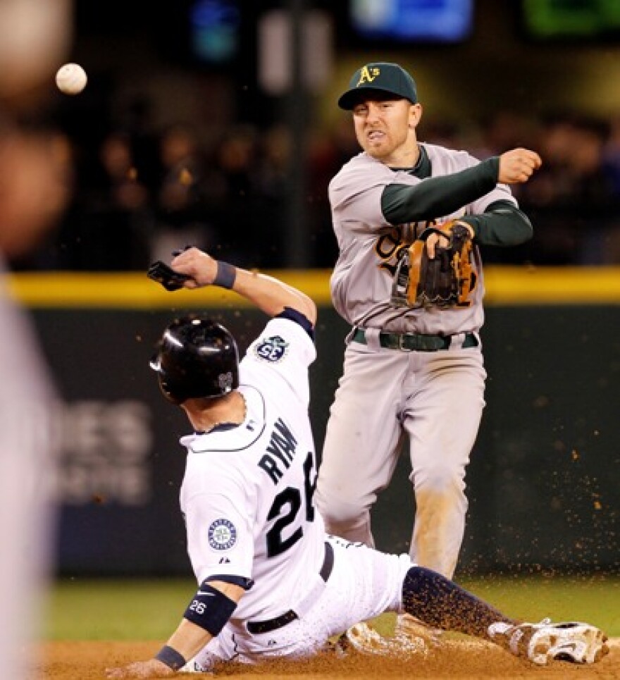 An 8th inning double play ends a potential rally in the Safeco Field home opener.