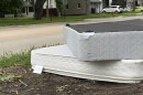 two mattresses are stacked on each other next to the roadside
