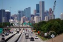 FILE - Traffic moves along Interstate 10 near downtown Houston, April 30, 2020.