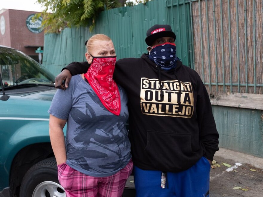 Dana Chavez, 49, wearing the red bandana; and Lori Stanberry, 44, are formerly homeless and now face eviction at the Hawthorne Suites motel in Sacramento