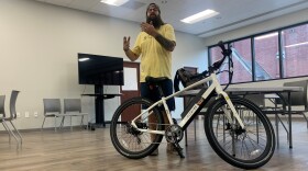 Dusty Casteen with one of the bikes used for tours of Wilmington.