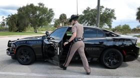 Florida Highway Patrol Trooper David Blake has a "ghost car" that has black graphics to help blend in with traffic.