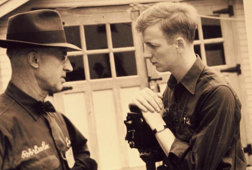Ed Robinson (right) in 1948. He is speaking to Herb Johnson, who was in charge of shipping for the J.C. Robinson Seed Co.