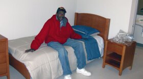 Billy Riley the bedroom of his new apartment at Moore Place.