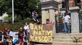 A group of Indigenous people, advocates, and lawmakers gathered outside the Massachusetts Statehouse Thursday, July 16, 2020, calling on the legislature to redesign the state's flag and motto. 