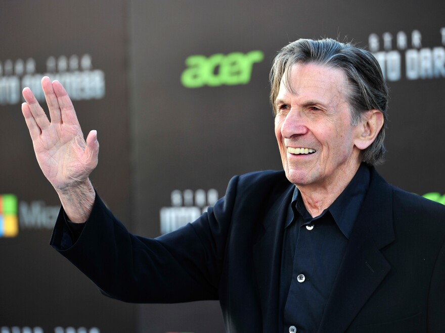 Nimoy flashes the famous Vulcan salute at the 2013 premiere of <em>Star Trek: Into Darkness</em>. He originally based the gesture on a Jewish blessing.