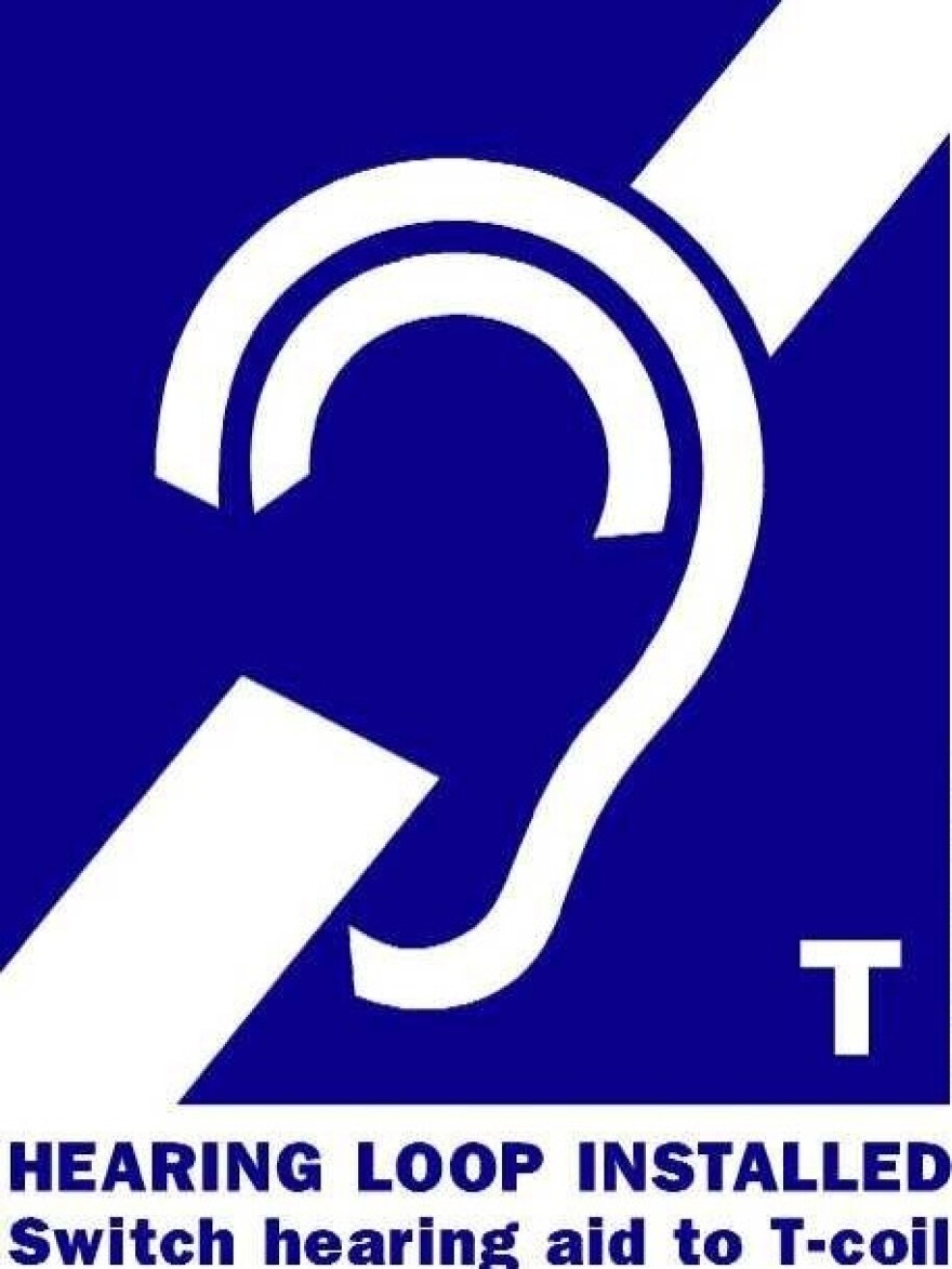 A hearing assistance sign with a 'T' lets people know they can activate their telecoil, or t-coil.