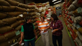 Three women in coffee leading the way: Stephanie Backus of Portland Roasting, coffee farmer Miguelina Villatoro of Guatemala, and coffee exporter/processor Loyreth Sosa. Here they discuss coffee prices as they survey beans ready for milling.