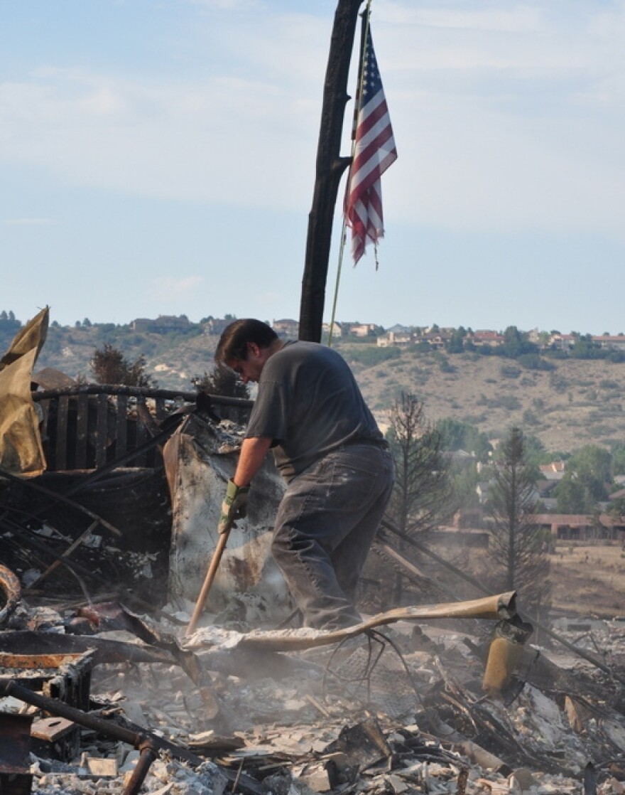 As soon as they were allowed back into the neighborhood, family members joined Janet Wilson in searching through the rubble of her house.