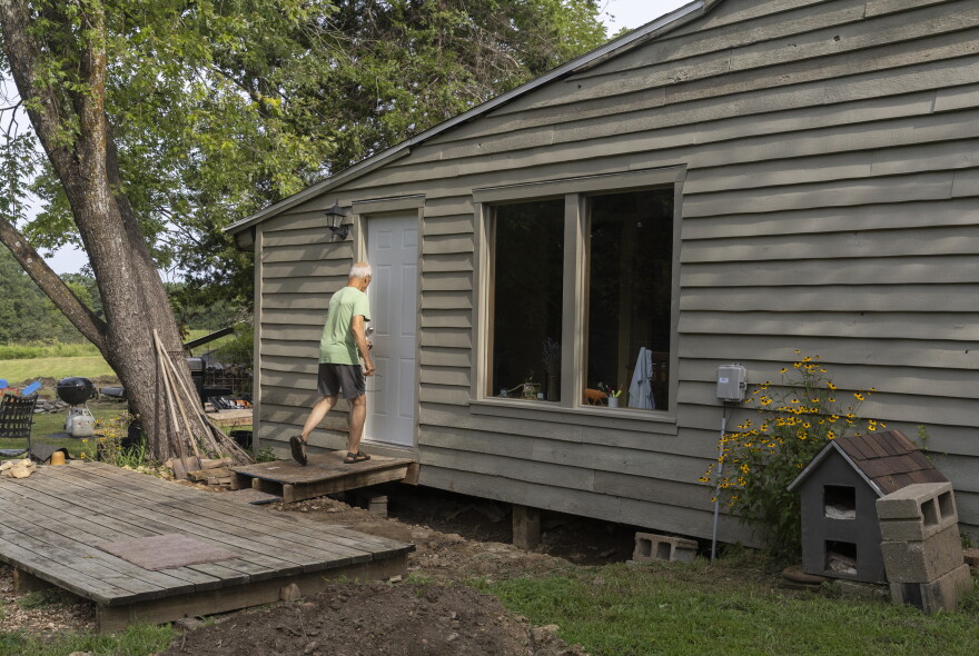 Dan Kuebler’s walks to his cabin on Aug. 13, 2026, in Ashland, Mo. Kuebler has lived at the cabin and its 30 acres of land since 1977.