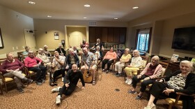 Wes Geer (center left) and members of Rock to Recovery at a senior home