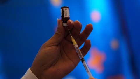 A health worker prepares a dose of the measles vaccine in Chapultepec Park in Mexico City, Sunday, Feb. 8, 2026.