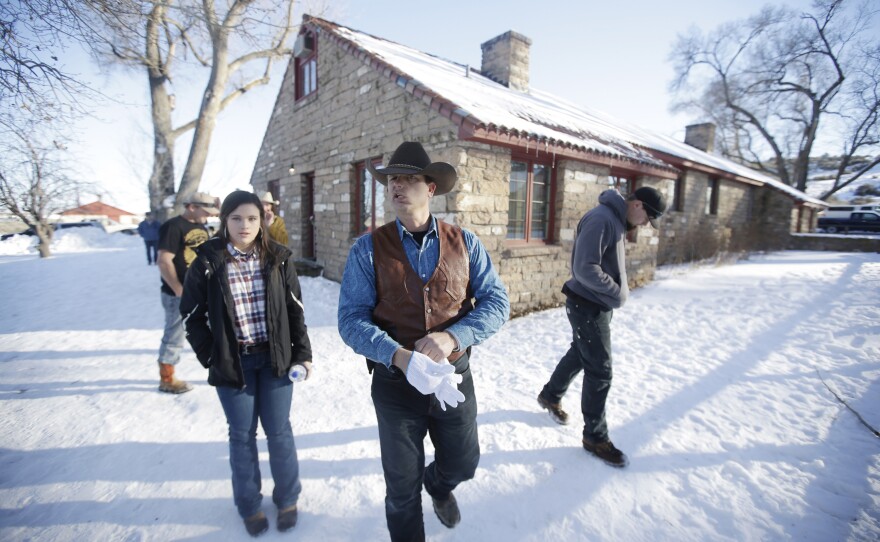 FILE - In this Jan. 8, 2016, file photo, Ryan Bundy walks through the Malheur National Wildlife Refuge near Burns, Ore. The armed takeover of Malheur National Wildlife Refuge and its aftermath was overwhelmingly selected Oregon's story of the year for 2016.