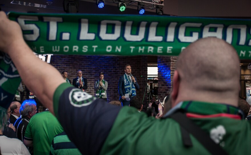 Fans watch Taylor Twellman, a St. Louis native and former U.S. men’s national team player-turned-ESPN commentator, speak Monday, at a rally supporting a soccer stadium. March 27, 2017