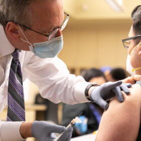Dr. Allan Radner administers a Covid-19 vaccine shot to a patient. Dr. Radner is Chief Medical Officer at Salinas Valley Memorial Healthcare System