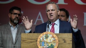 Then-Florida Commissioner of Education Richard Corcoran speaks alongside Gov. Ron DeSantis and state Sen. Manny Diaz Jr. on Sept. 14, 2021, at the Doral Academy Preparatory School in Doral, FL.