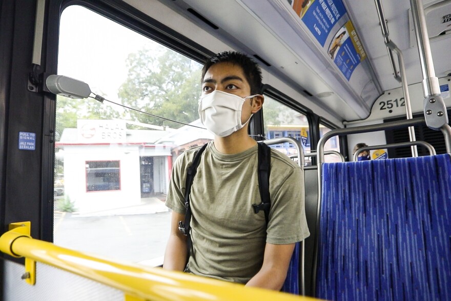 Graduate student Ryan Natividad rides a Capital Metro bus from his apartment in Hyde Park to the UT Austin campus.