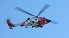 A United States Coast Guard helicopter flying over Kodiak, February 19, 2023. (Brian Venua/KMXT)