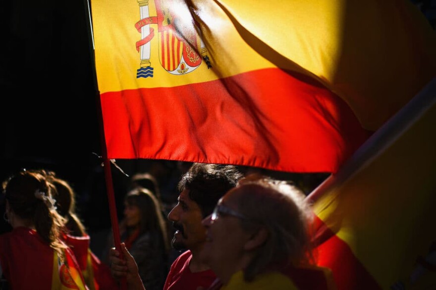 People make their way home following a rally march against independence through Barcelona in response to the disputed referendum on Catalan independence, Oct. 8, 2017. Catalonia's president Carles Puigdemont will address the Catalan Parliament on Oct. 10 to discuss the result of the referendum that was held on Oct. 1.  (Jeff J Mitchell/Getty Images)