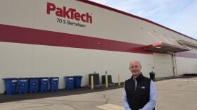 Paktech CEO Brandon Rogers stands in front of the company's west Eugene facility.