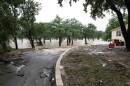 July 16, 2026: Debris covers a yard in Kerrville from the Guadalupe River rising over into residential properties. Kerrville, Texas.