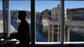 People attend a news conference on Lake Mead at Hoover Dam, April 11, 2023, near Boulder City, Nevada.
