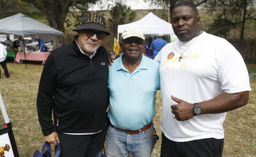 (From left) Kerfoot Lewis, Norris Brothers, and Maress Scott pose for a photo during the 2022 Publix Tampa Bay Collard Festival in St. Petersburg, Florida, on Saturday, February 19, 2022. Photo by Octavio Jones for WUSF