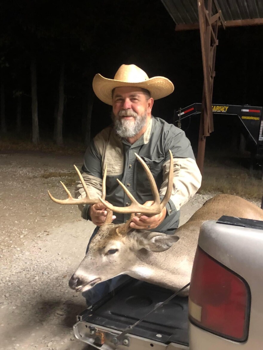 Charlie Nassar shows off a buck