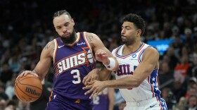 Phoenix Suns forward Dillon Brooks (3) dribbles the ball against Philadelphia 76ers guard Quentin Grimes during the second half of an NBA basketball game Saturday, Feb. 7, 2026, in Phoenix.