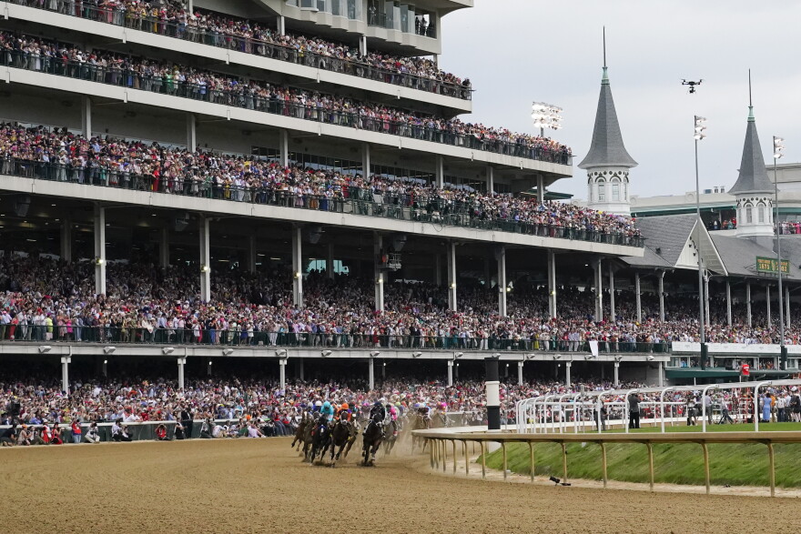Horses make the first turn as they compete during the 149th running of the Kentucky Derby horse race at Churchill Downs Saturday, May 6, 2023, in Louisville, Ky. (AP Photo/Julio Cortez)