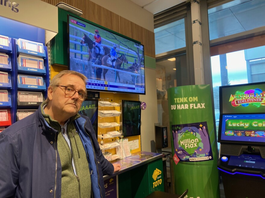 Jonny Engebo is a researcher for the Norwegian gambling authority who has studied gambling policy for twenty years. He is at a convenience store in Oslo where customers can buy lottery tickets, play online casino games, or bet on the horses.