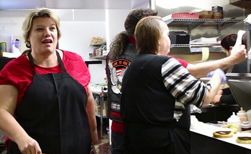 Mayoral candidate Donia Jessop works in the kitchen of her new fast food restaurant and convenience store The Hub, 24 hours before the polls close.