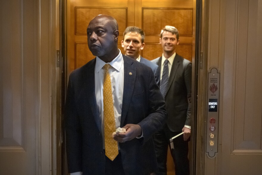 Sen. Tim Scott, R-S.C., steps out of an elevator as Republicans begin a final push to advance President Donald Trump's tax breaks and spending cuts package, at the Capitol in Washington, Monday, June 30, 2025.
