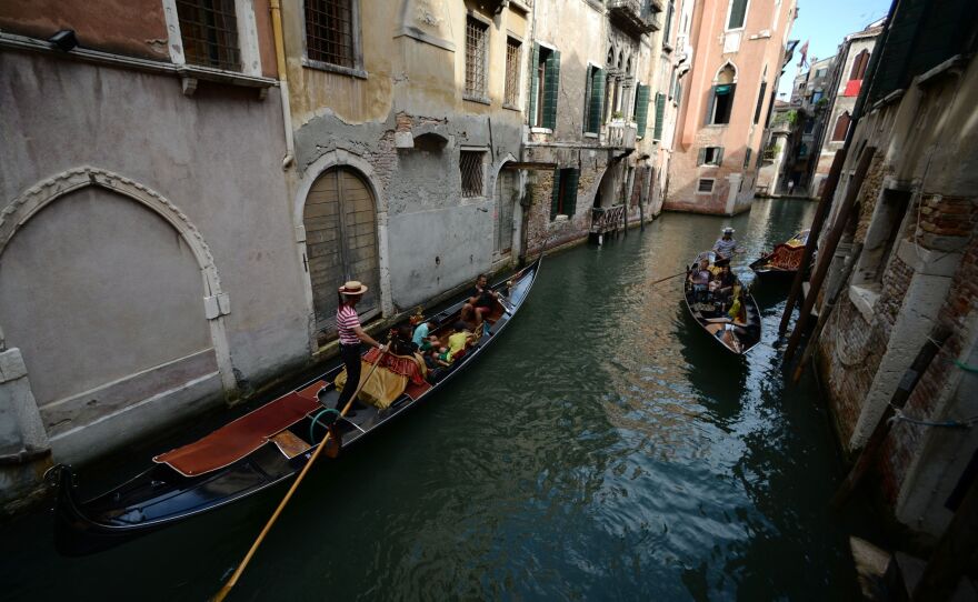 A gondola sails in a Venice canal in September.