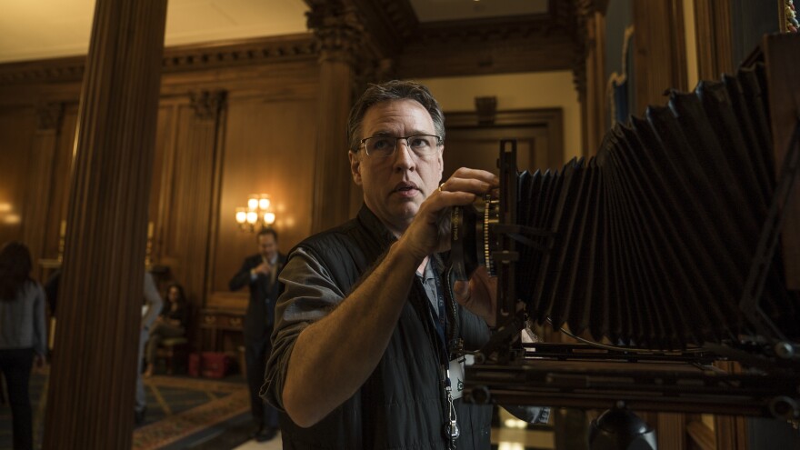 Photographer Greg Miller sets up his camera in the Rayburn Reception Room on Capitol Hill.