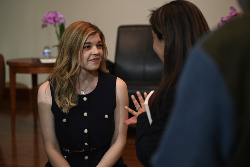 Alexis Meruelo talking to an audience member just after an event at the University of Nevada, Reno.