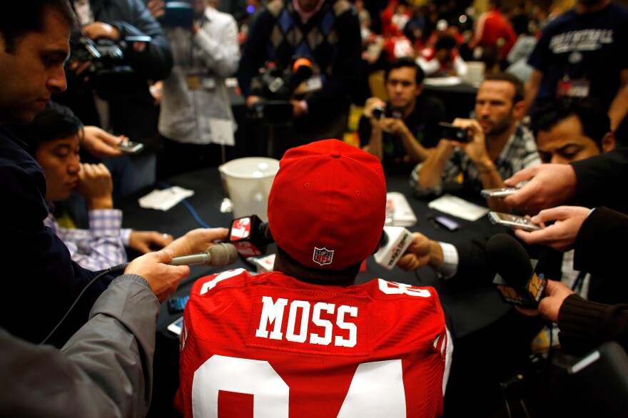 Randy Moss of the San Francisco 49ers addresses the media on Jan. 31.