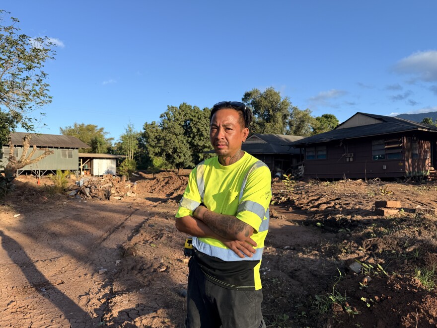Marck Aphay stands among the ruins of Otake Camp on April 23, 2026.