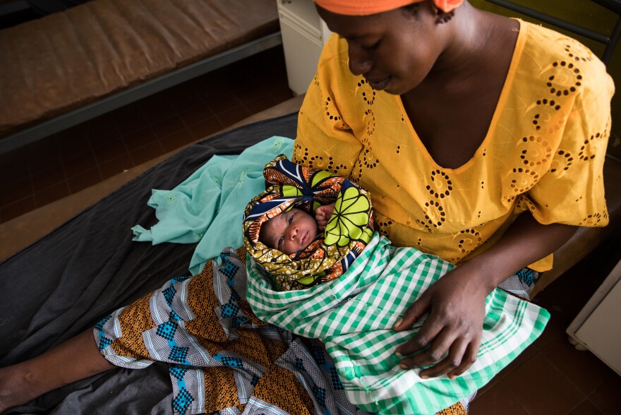 Naba Dabo, 25, holds her day-old baby at the maternity ward of the Brufut Minor Health Center outside of Banjul in the Gambia. The midwives at the clinic say that they don't administer pain medication during childbirth because, in their view, most of the time it's "not needed."