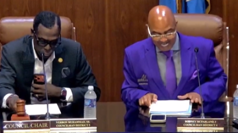2 men at a Monroe City Council meeting