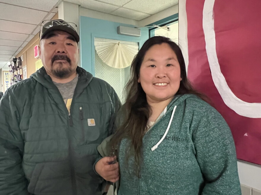 Lacey and Darrell John at College Gate Elementary on Oct. 3, 2025, the day a bus took their daughter, Emi, to the wrong shelter. Their smiles show their relief at finding out their daughter was safe.