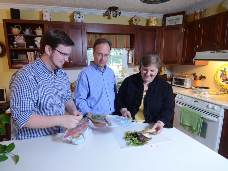 Brian Griffith (left), shown here in 2009 at age 26, moved home with his parents, Jay and Jennifer Griffith, after losing his job. The tight job market, especially for college grads, has prompted many young adults to move back in with their parents.