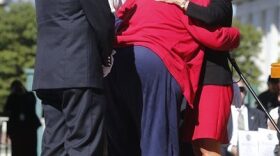 New York Lt. Gov. Kathy Hochul, right, hugs Diane Edwards, wife of deceased Liberty volunteer firefighter Fred Edwards, during a ceremony at the New York State Fallen Firefighters Memorial. (AP Photo/Mike Groll)