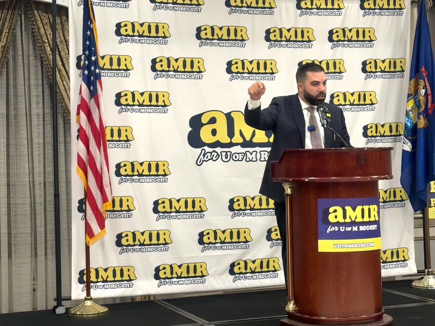 Civil rights attorney Amir Makled speaks passionately to a room of supporters in front of a campaign banner during his University of Michigan Board of Regents bid announcement.