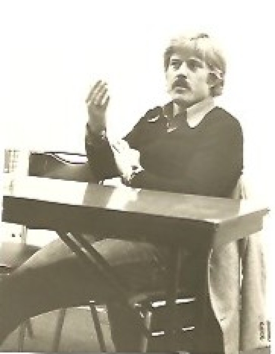 Robert Redford sitting behind a desk talking.